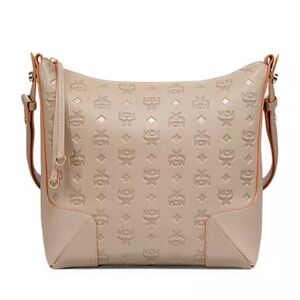 Authentic MCM adjustable strap bag  Dimensions: 12.5"W x 4"D x 11"H